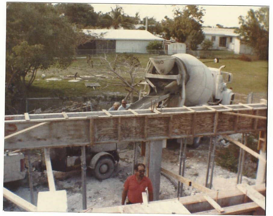 Arnie Steinmetz pouring beams for the house in 1982,